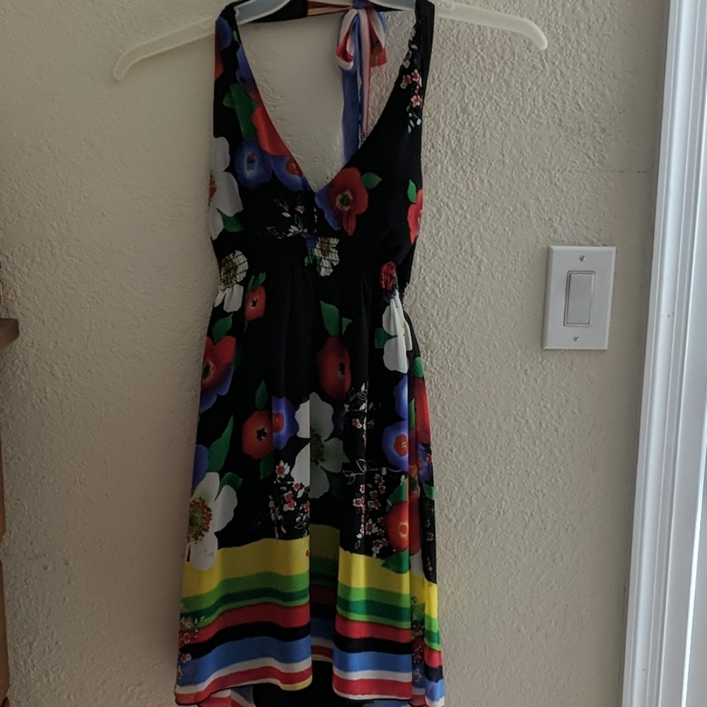 Colorful and open back dress.